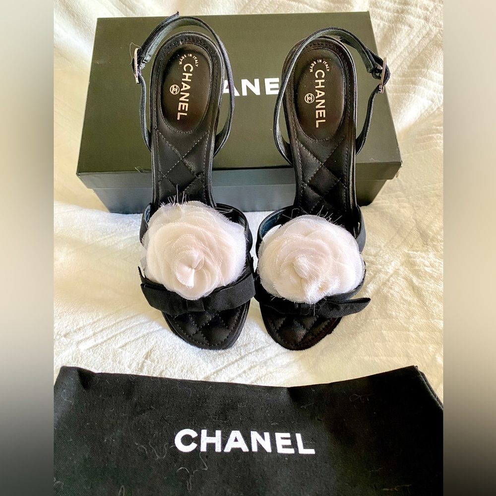 Authentic Chanel Camellia sling backs by Karl Lagerfeld. Black Size 37.5